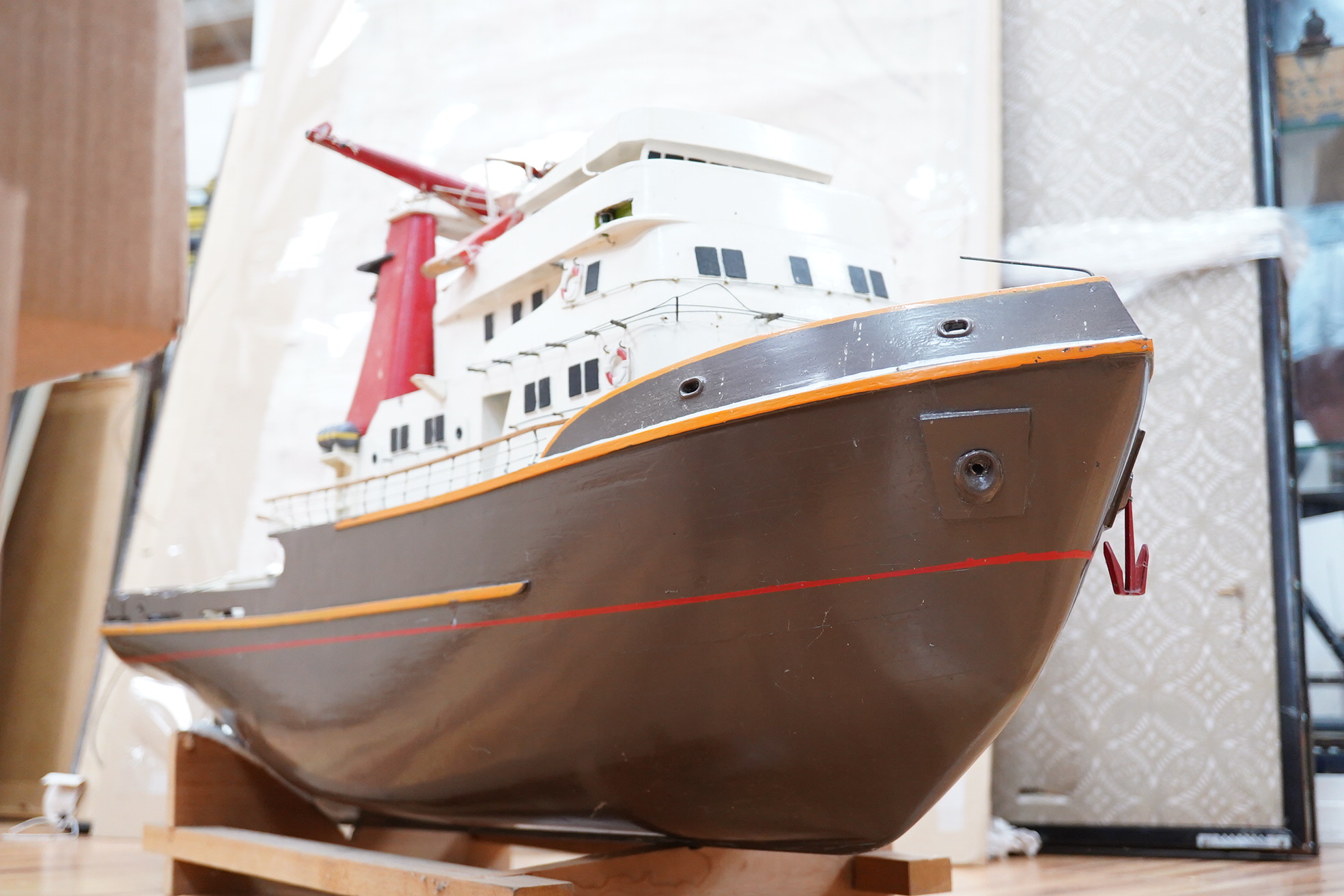 A model of the tugboat Amsterdam, probably built from a kit as a pond yacht, and powered by an electric motor, length of hull approx 103cm, of primarily painted wood construction